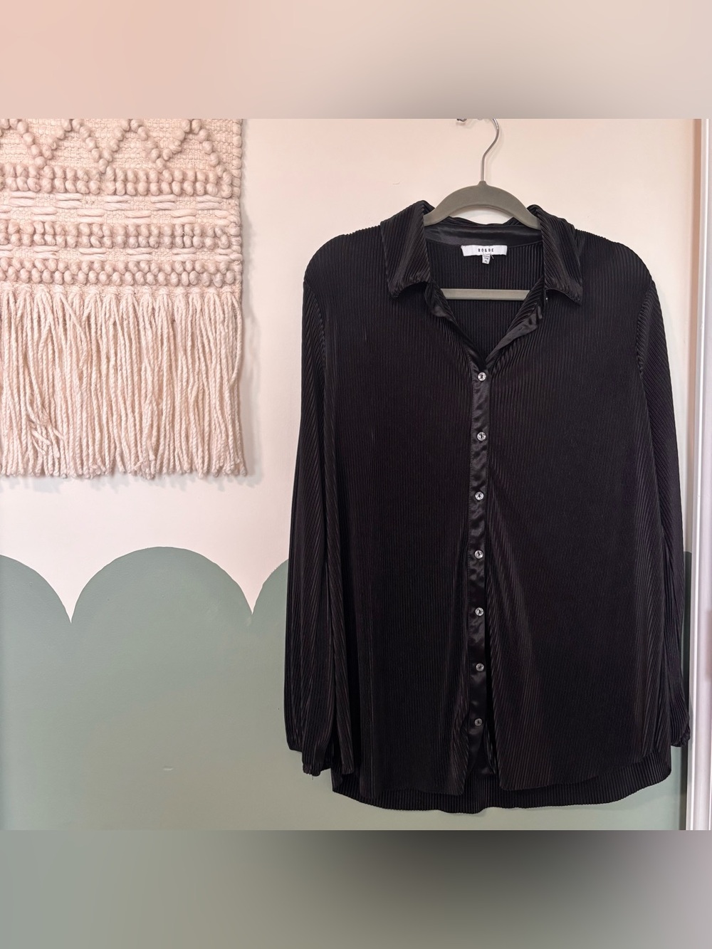 Black button-up blouse with satin collar and cuffs